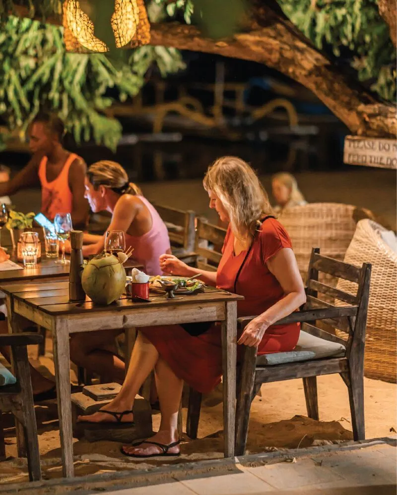 Candle-lit tables on the sand at Lilla Pantai